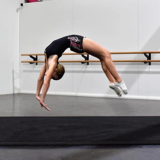 SDS Griffith student performing a back flip in the acrobatics studio